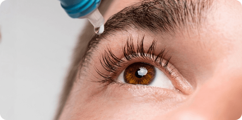 Close view of an eye receiving drops