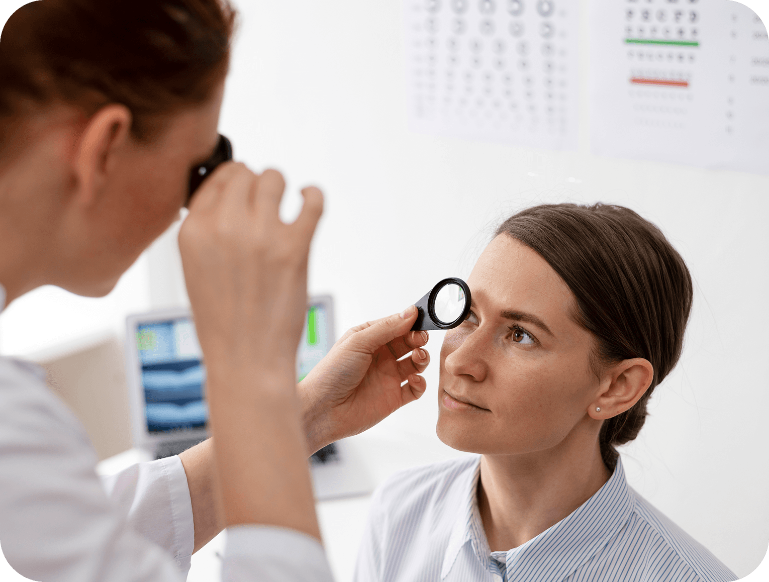 Eye examination with a handheld lens
