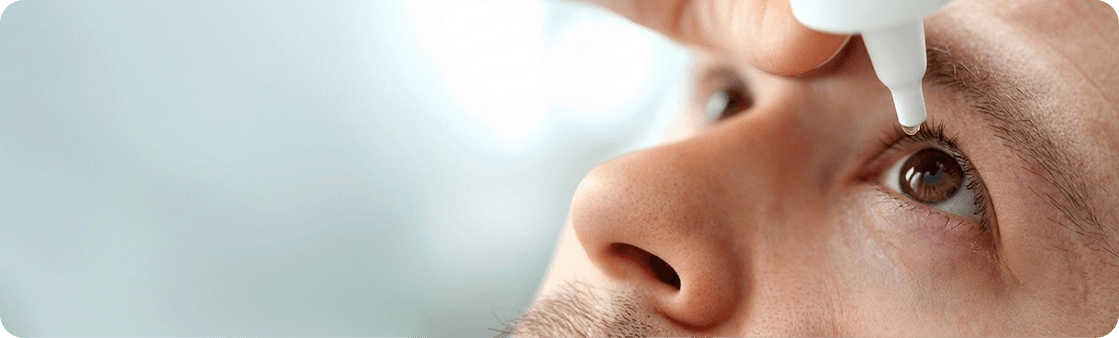 Eye drops being applied during squint care